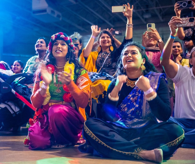 <strong>Kavya Chowdary and Sanjana Kosuri, dance instructors, help a group with their performance at the IndiaFest at the Agricenter International, Saturday. Despite the rain, the turnout had record numbers of attendees.</strong> (Greg Campbell/Special to The Daily Memphian)