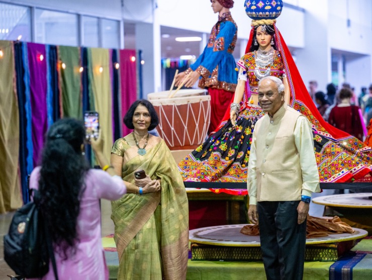 <strong>Kalpana Shiva and her husband Sajjam Shiva have a photo taken beside a display of a traditional Indian celebration attire.</strong> (Greg Campbell/Special to The Daily Memphian)