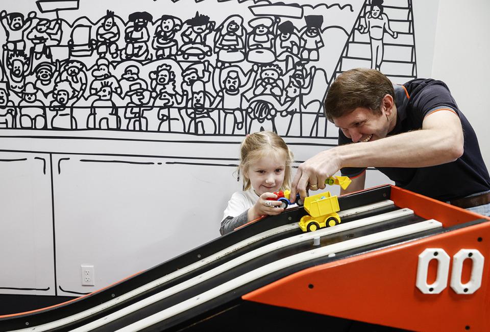 <strong>Justin McCandless and his daughter Jillian McCandless, 4, play in the AutoZone exhibit at the Children's Museum of Memphis on Friday, Nov. 8, 2024.</strong> (Mark Weber/The Daily Memphian)