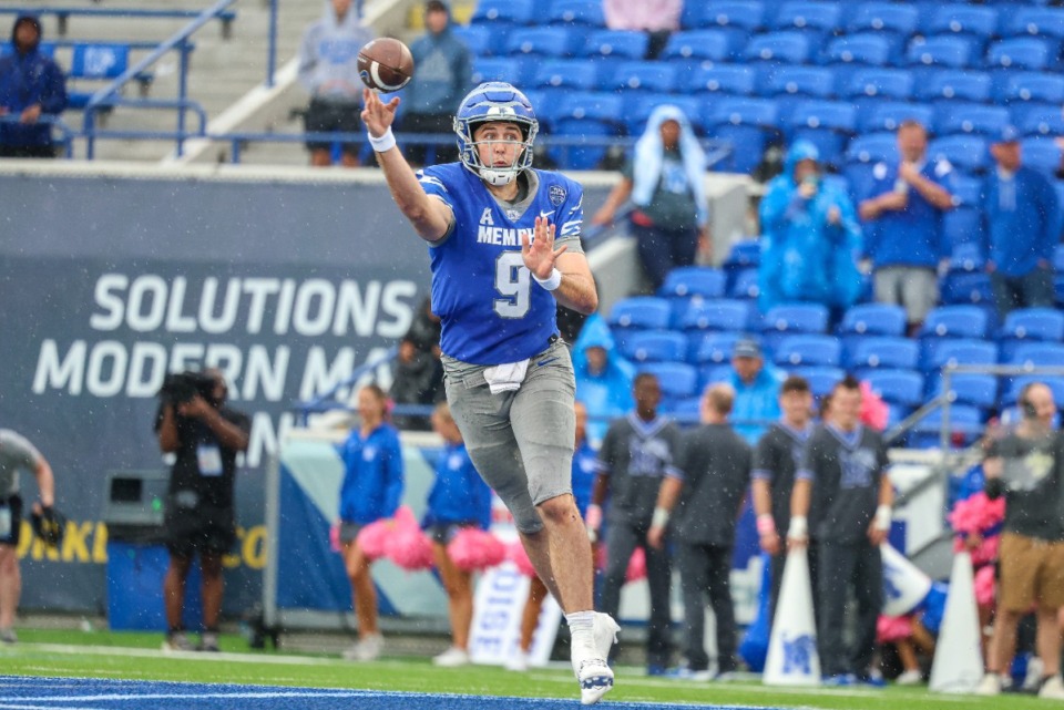 <strong>Memphis Tiger quarter back Seth Henigan (9) throws the ball during the third quarter against Charlotte on Oct 26, 2024 at Simmons Bank Liberty Stadium.</strong> (Wes Hale/Special for The Daily Memphian)