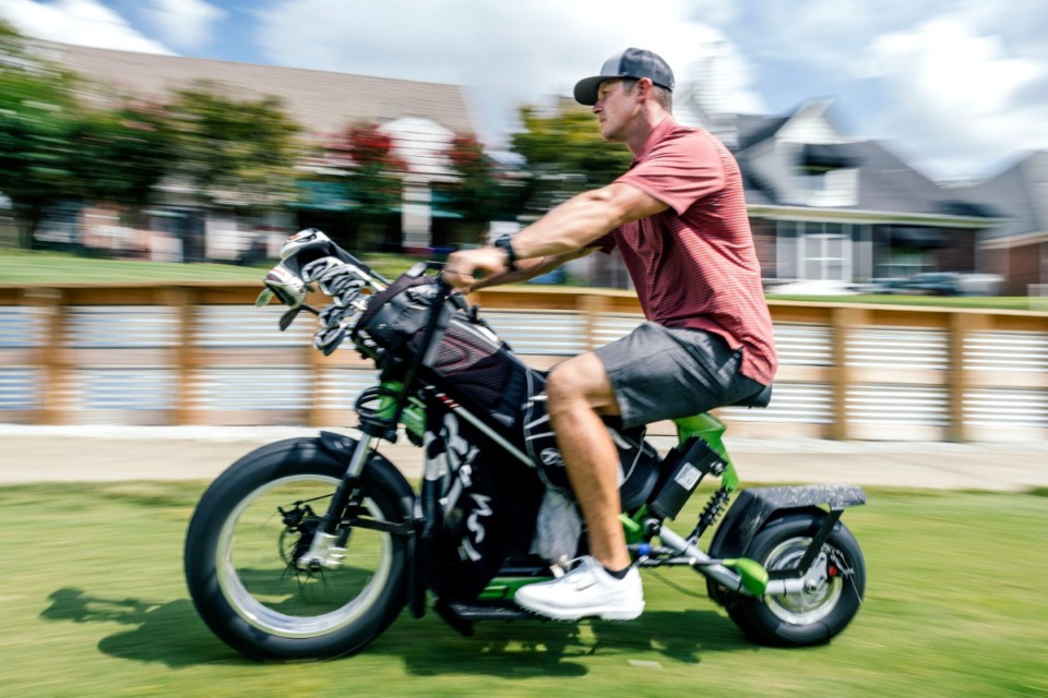 <strong>Stephen Margeson tries one of Timber Truss Golf Course's new two-wheelers as he makes his way down the fairway on hole 15 of the course. With its fat tires that don't damage tees and green fringes, the cycles let the golfer go faster and more directly to the ball, which increases the speed of play.</strong> (Houston Cofield/Special to the Daily Memphian)