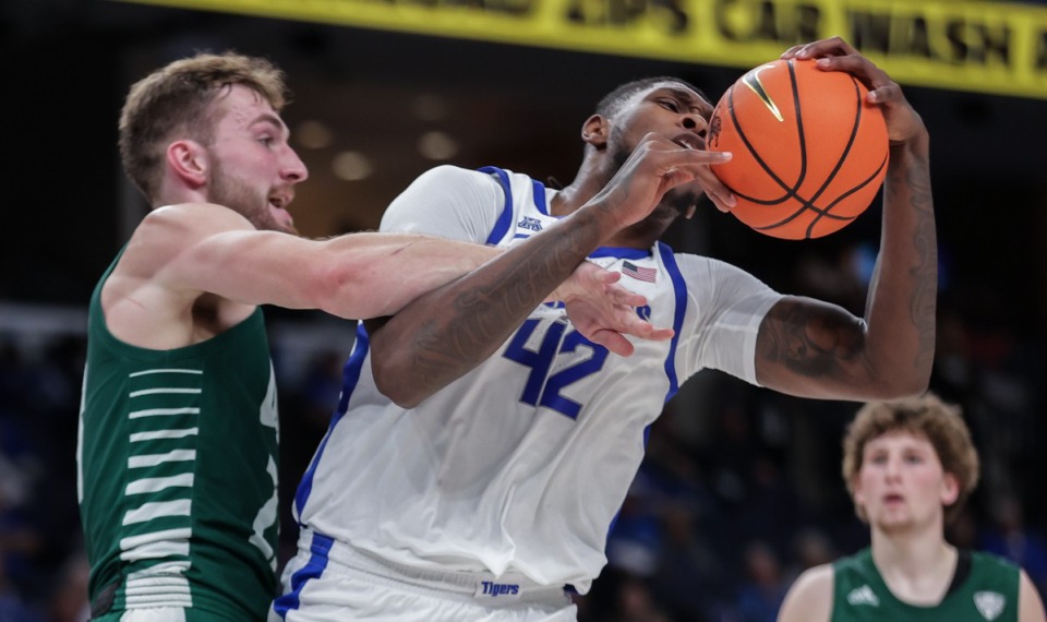 <strong>Memphis&rsquo; Dain Dainja (42) gets fouled during what was a tough game against Ohio U., until the Tigers flipped a switch and put the Bobcats away.</strong> (Patrick Lantrip/The Daily Memphian)