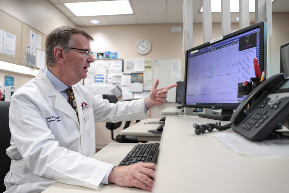 <strong>Dr. Robert Schriner looks at a polysomnogram sleep-study report at Baptist Collierville on Nov. 6.</strong> (Patrick Lantrip/The Daily Memphian)