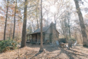 <strong>An old log cabin is available for overnight stays at The Retreat House property.</strong> (Courtesy Morgan Hibbs Photography)