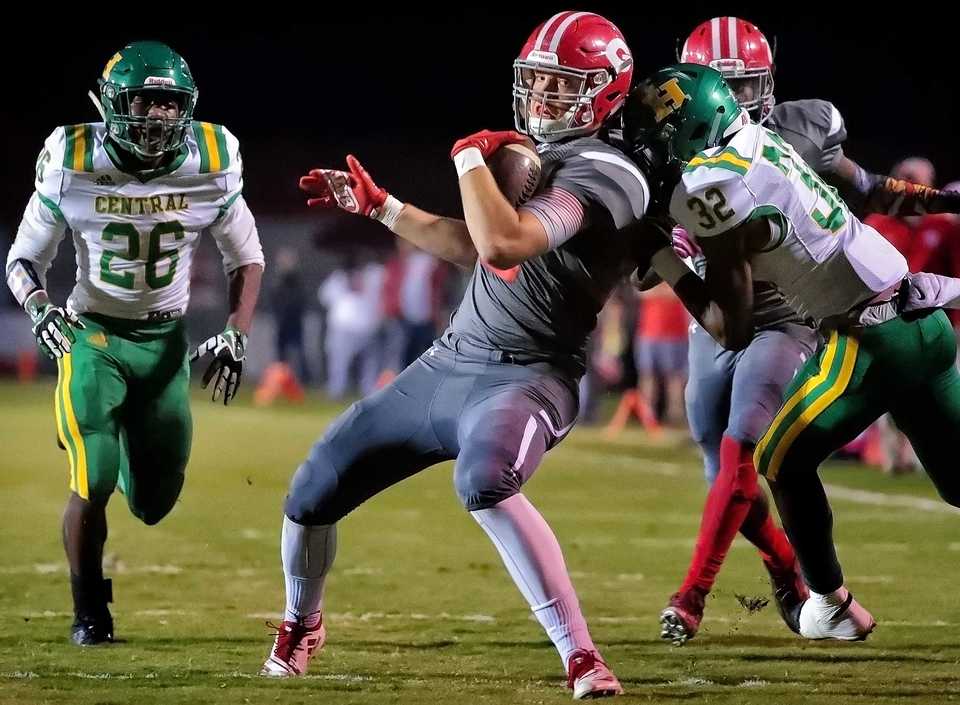 <strong>Germantown fullback Conner Richardson is brought down by Central's Tyran Perkins during Germantown's game against Central High School in Germantown on Oct. 19, 2019.</strong> (Jim Weber/Daily Memphian)