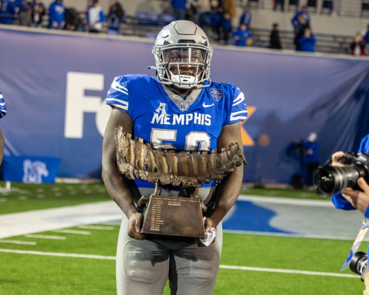 <strong>Memphis Tiger defensive lineman Patrick Lucas Jr. (50) holds the Battle of the Bones trophy after winning the game against the UAB Blazers on Nov. 16, 2024 at Simmons Bank Liberty Stadium.</strong> (Wes Hale/Special to The Daily Memphian)