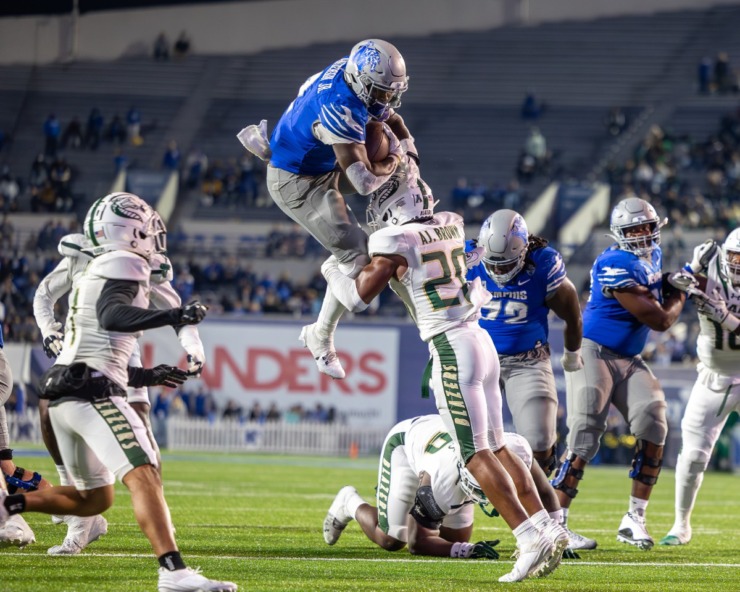 <strong>Memphis Tiger running back Mario Anderson (2) tries to hurdle UAB Blazers defensive back AJ Brown (20) during the second half on Nov. 16, 2024 at Simmons Bank Liberty Stadium.</strong> (Wes Hale/Special to The Daily Memphian)