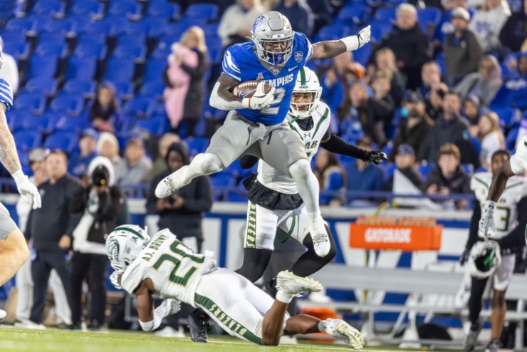 <strong>Memphis Tiger running back Mario Anderson (2) hurdles UAB Blazers defensive back AJ Brown (20) during the second half on Nov. 16, 2024 at Simmons Bank Liberty Stadium.</strong> (Wes Hale/Special to The Daily Memphian)