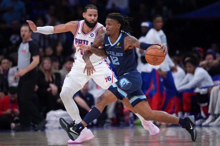 Memphis Grizzlies' Ja Morant, right, tries to get past Philadelphia 76ers' Caleb Martin during the first half of an NBA basketball game, Saturday, Nov. 2, 2024, in Philadelphia. (AP Photo/Matt Slocum)