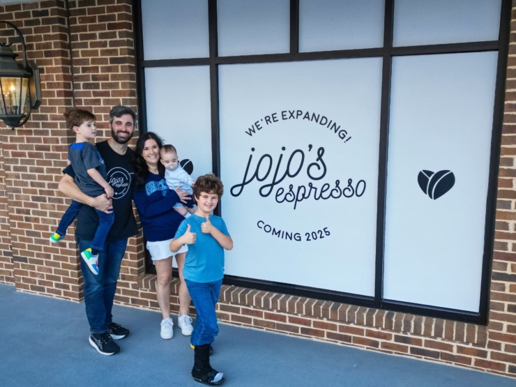 The Whiddon family stand in front of their new location. (Courtesy Taylor Whiddon)