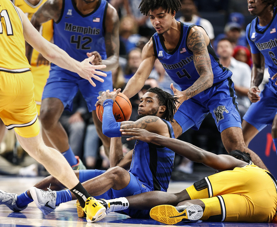 <strong>University of Memphis guard Tyrese Hunter (middle) grabs a loose ball against University of Missouri during action on Monday, Nov. 4, 2024.</strong> (Mark Weber/The Daily Memphian)