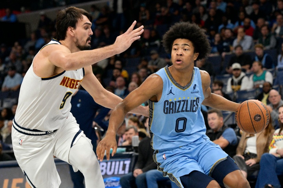 <strong>Memphis Grizzlies forward Jaylen Wells (0) handles the ball against Denver Nuggets forward Dario Saric (9) in the first half of an Emirates NBA Cup basketball game Tuesday, Nov. 19, 2024.</strong> (Brandon Dill/AP)