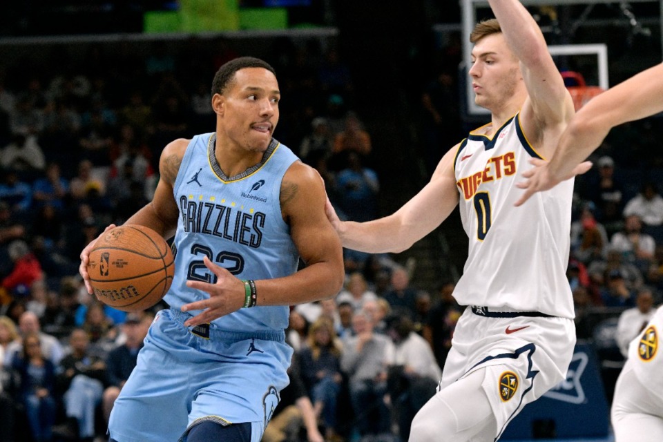 <strong>Memphis Grizzlies guard Desmond Bane (22) handles the ball against Denver Nuggets guard Christian Braun (0) in the first half of an Emirates NBA Cup basketball game Tuesday, Nov. 19, 2024.</strong> (Brandon Dill/AP)