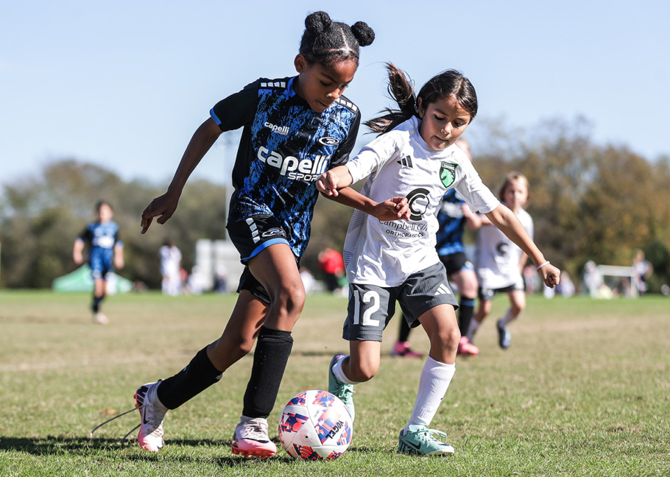 <strong>Youth players for the Germantown Legends and Lobos Rush - DeSoto fight for a loose ball during a tournament at Mike Rose Soccer Complex Nov. 16, 2024.</strong> (Patrick Lantrip/The Daily Memphian)