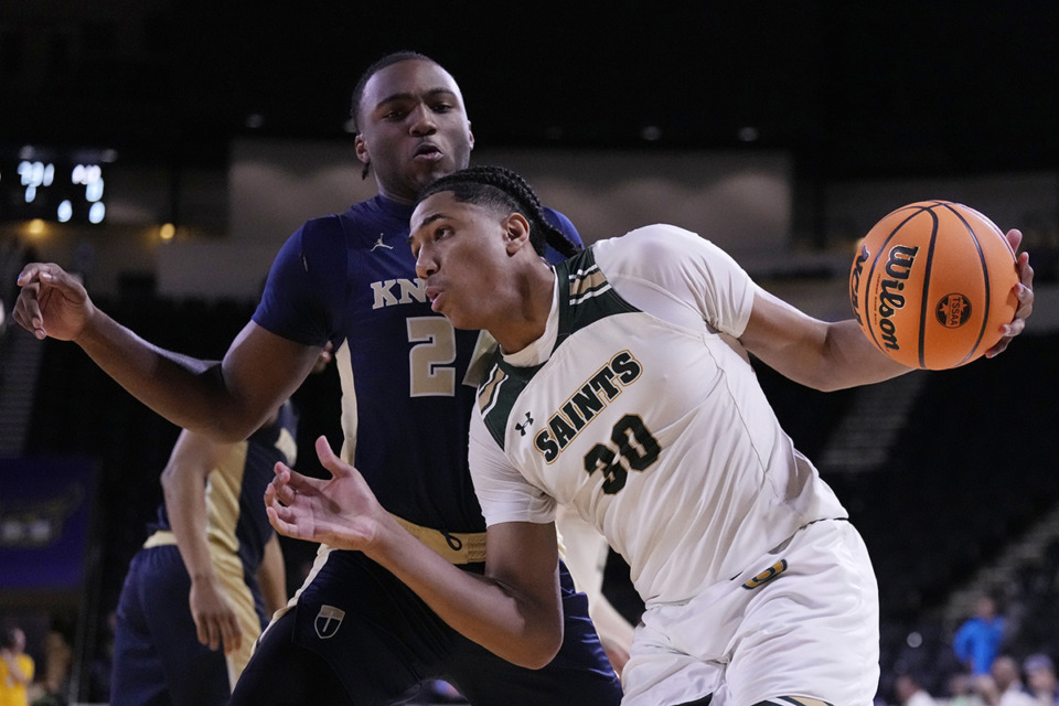 <strong>Briarcrest Christian forward Fred Smith (30) drives against Pope John Paul II forward Antonio Wilkerson during the first half of a Division II-AA semifinal basketball game Thursday, Feb. 29, 2024, in Cookeville, Tenn.</strong> <strong>Smith had a couple of highlight-reel dunks and scored 20 of his 22 points in the first half Tuesday against visiting Trezevant</strong>. (Mark Humphrey/Special to The Daily Memphian)