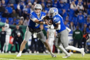 <strong>Memphis Tiger quarter back Seth Henigan (9) hands the ball to Memphis Tiger running back Mario Anderson (2) during the first half against the UAB Blazers on Nov 16, 2024 at Simmons Bank Liberty Stadium.</strong> (Wes Hale/Special to the Daily Memphian)