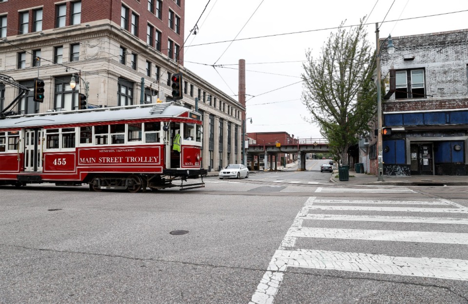 <strong>In a 2023 photo, a MATA trolley rolls down Main Street across G.E. Patterson Avenue.</strong> (Mark Weber/The Daily Memphian file)