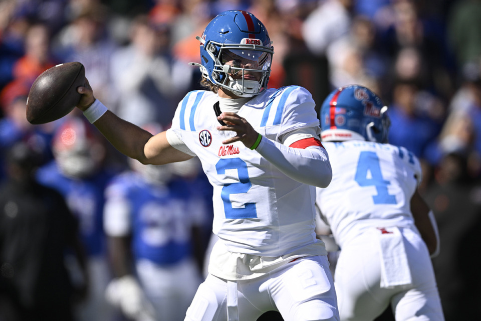 <strong>Mississippi quarterback Jaxson Dart (2) throws a pass against Florida during the first half of an NCAA college football game Saturday, Nov. 23, in Gainesville, Fla.</strong> (Phelan M. Ebenhack/AP file)