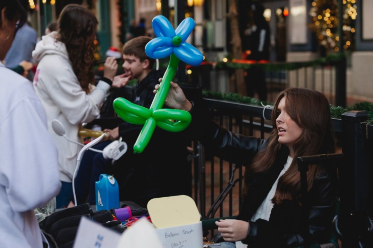 <strong>Artists paint kids' faces and make balloon animals on Main Street, Saturday, Nov. 23, 2024 during the Downtown Holiday Tree Lighting sponsored by the Downtown Memphis Commission.</strong> (Ziggy Mack/Special to The Daily Memphian)