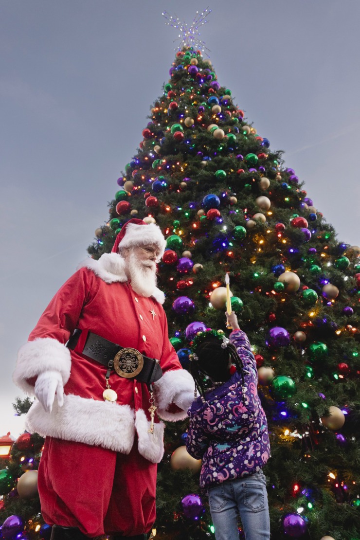 <strong>A girl helps Santa light the Christmas tree during the Saturday, Nov. 23, 2024 Downtown Holiday Tree Lighting sponsored by the Downtown Memphis Commission.</strong> (Ziggy Mack/Special to The Daily Memphian)