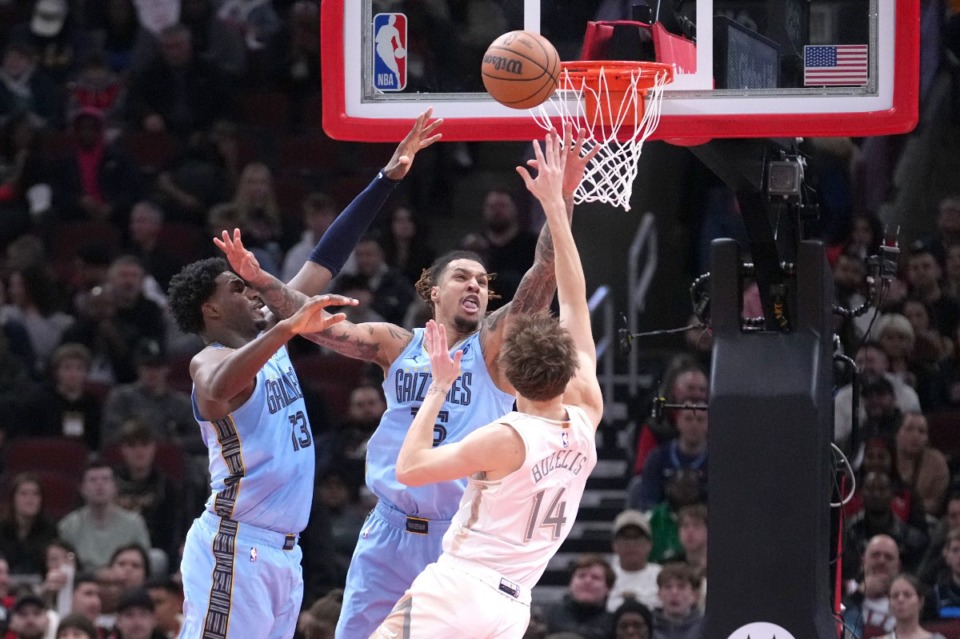 <strong>Chicago Bulls' Matas Buzelis (14) shoots under pressure from Memphis Grizzlies' Jaren Jackson Jr. (left) and Brandon Clarke during the first half of an NBA basketball game Saturday, Nov. 23, 2024, in Chicago.</strong> (Charles Rex Arbogast/AP)