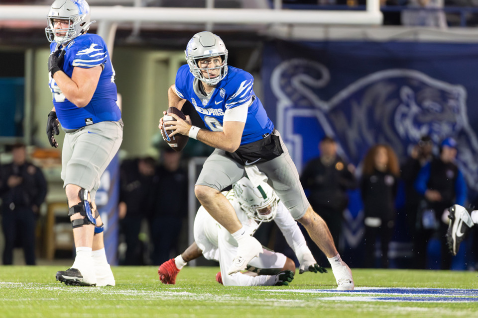 <strong>The Memphis Tigers football moved up one spot in the Coaches Poll. Tigers quarterback Seth Henigan (9) scrambles against the UAB Blazers during the first half on Nov. 16, 2024 at Simmons Bank Liberty Stadium.</strong> (Wes Hale/Special to the Daily Memphian)