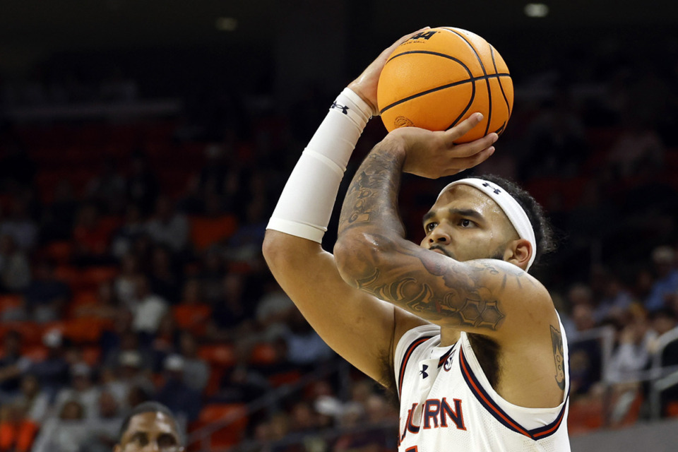 <strong>Auburn forward Johni Broome shoots a three-pointer during the second half of an NCAA college basketball game against North Alabama, Monday, Nov. 18, 2024, in Auburn, Ala</strong>. (Butch Dill/AP Photo)