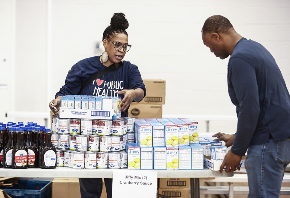 <strong>Volunteers fill boxes with goods to hand out to the community during Mississippi Boulevard Christian Church&rsquo;s fifth Annual MemFeast.</strong> (Mark Weber/The Daily Memphian)