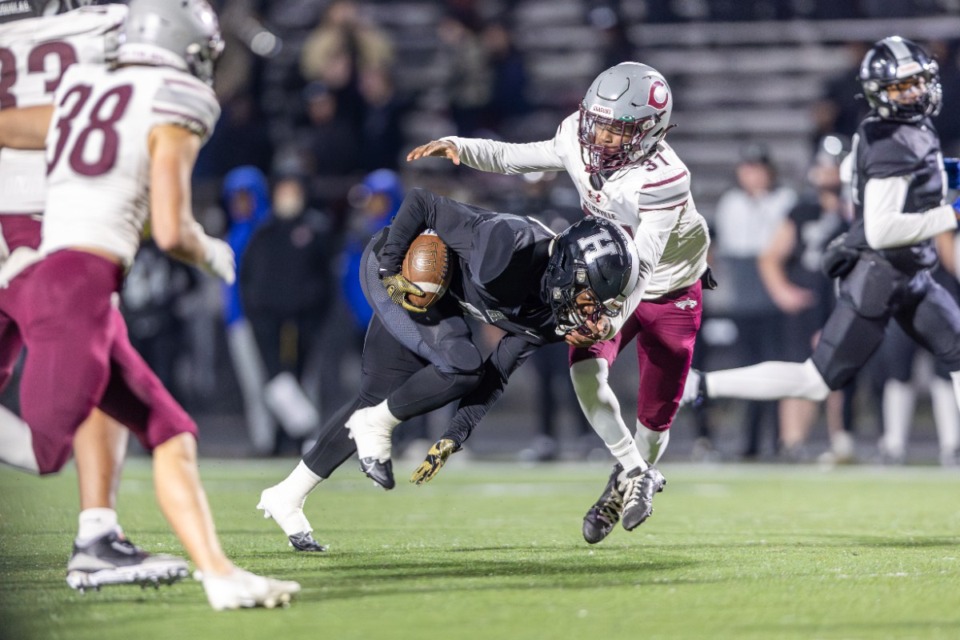 <strong>Ladeadrick James (3) of the Houston Mustangs is tackled by Collierville Dragons defensive back Kylan Holmes (31) during the first half at Houston High School on Friday, Nov. 22, 2024.</strong> (Wes Hale/Special to the Daily Memphian)