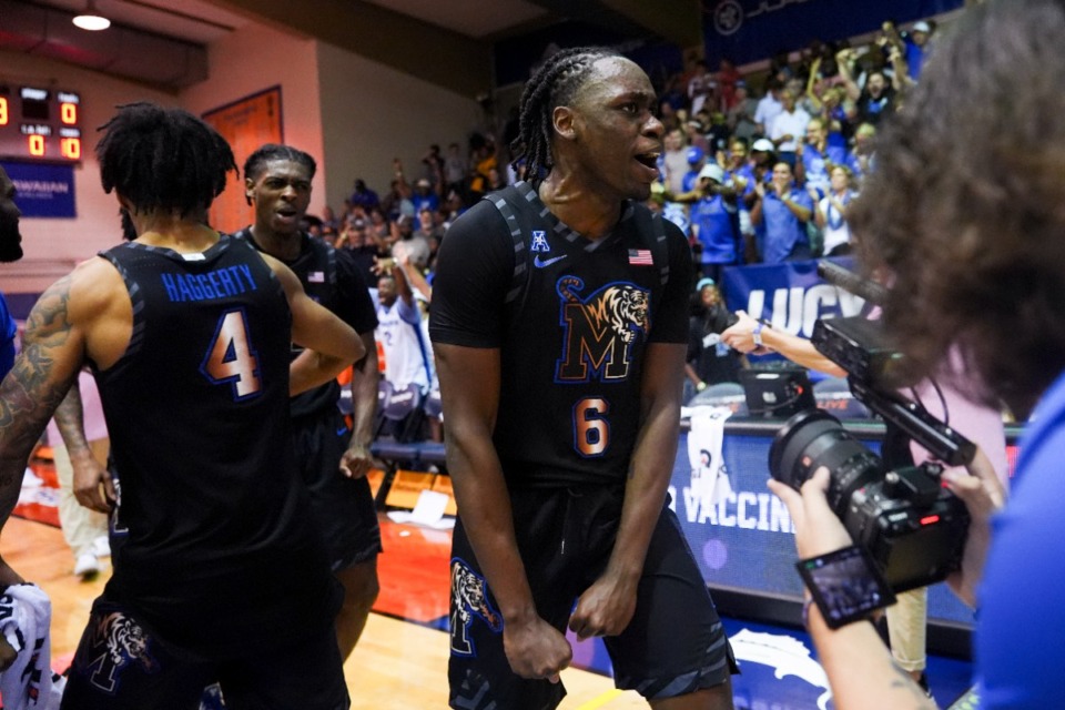 <strong>Memphis guard Baraka Okojie (6) reacts with guard PJ Haggerty (4) as they celebrate Monday&rsquo;s 99-97 win over UConn at the Maui Invitational in Lahaina, Hawaii.</strong> (AP Photo/Lindsey Wasson)