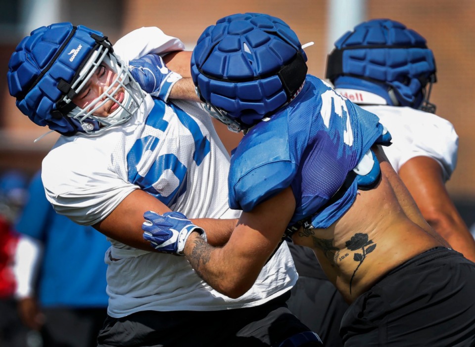 <strong>University of Memphis offensive lineman Manuel Orona-Lopez (left) blocks teammate Tyler Garvey during practice Monday, Aug. 5. Orona-Lopez will be starting at right guard when Memphis plays Ole Miss Saturday at the Liberty Bowl.</strong> (Mark Weber/Daily Memphian)