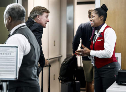 <strong>Delta Air Lines customer service expert Beverly Becton (right) greets Memphian Mott Ford as he board his flight to Atlanta. Becton starts her workday at 3:30 a.m.</strong> (Mark Weber/The Daily Memphian)