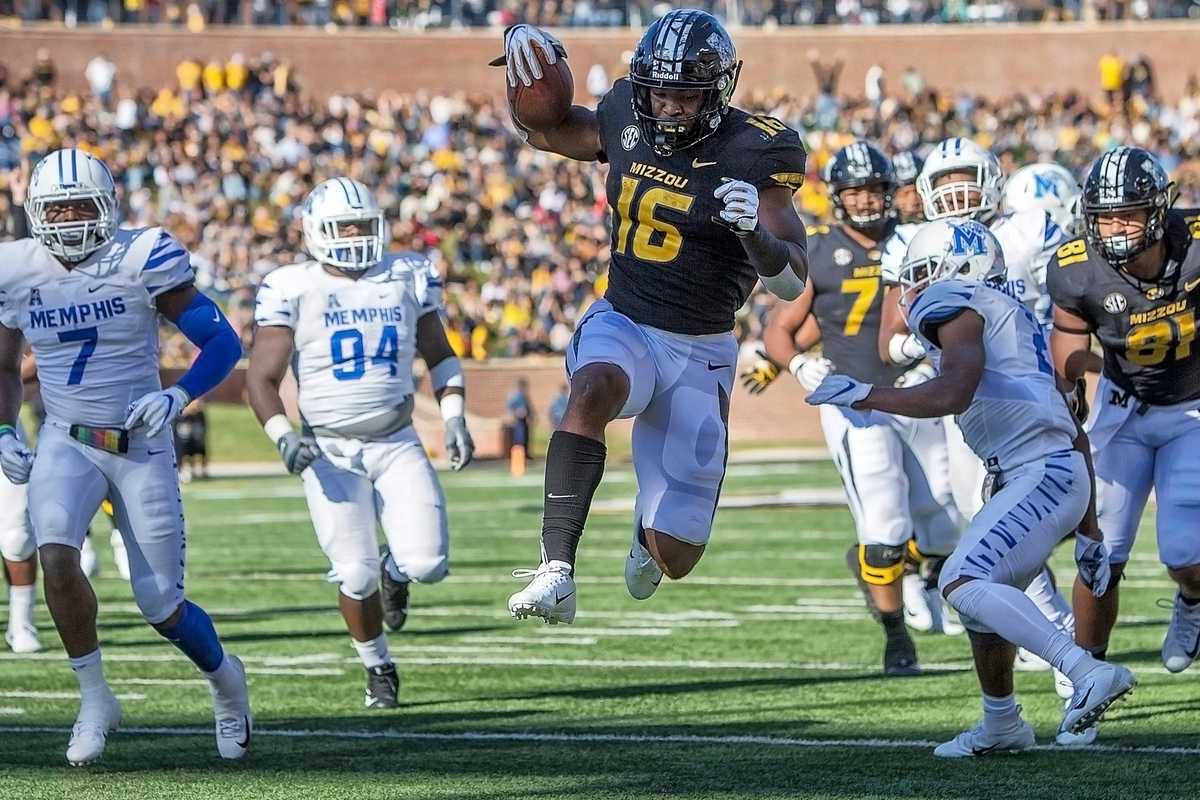 <strong>Missouri Tigers running back Damarea Crockett (16) leaps into the end zone for a touchdown during the first half of a college football game against the Memphis Tigers Saturday, Oct. 20, 2018, in Columbia, Missouri.</strong>&nbsp; (Icon Sportswire via AP Images)