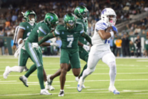 <strong>Memphis running back Greg Desrosiers Jr., right, takes a reception into the end zone against Tulane defenders during the first half of an NCAA college football game in New Orleans, Thursday, Nov. 28, 2024.</strong> (AP Photo/Peter Forest)