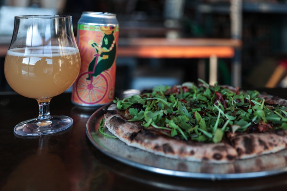 <strong>The Big Sur pizza at Hampline Brewing Company is topped with both brie and mozzarella cheeses, figs, pears and prosciutto. Fresh arugula and balsamic drizzle are added when the pizza is out of the oven.</strong> (Patrick Lantrip/The Daily Memphian)