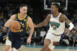 <strong>Indiana Pacers guard T.J. McConnell, left, handles the ball against Memphis Grizzlies guard Ja Morant (12) in the first half of an NBA basketball game Sunday, Dec. 1, 2024, in Memphis.</strong> (Brandon Dill/AP Photo)