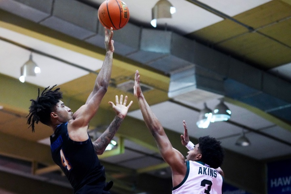 <strong>Memphis guard PJ Haggerty, left, shoots against Michigan State guard Jaden Akins (3) during the first half of an NCAA college basketball game at the Maui Invitational Tuesday, Nov. 26, 2024, in Lahaina, Hawaii.</strong> (AP Photo/Lindsey Wasson)