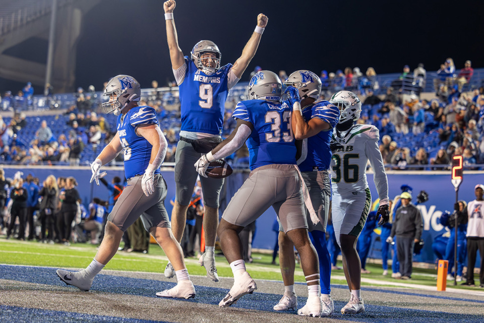 <strong>Memphis Tiger quarterback Seth Henigan (9) celebrates after a touchdown pass to Memphis Tiger tight end Jamauri Chislom (33) during the second half against the UAB Blazers on Nov 16 at Simmons Bank Liberty Stadium</strong>. (Wes Hale/Special to the Daily Memphian file)&nbsp;