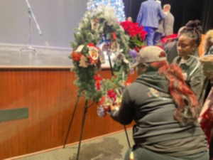 <strong>A family places an ornament on one of the four wreaths at the remembrance ceremony hosted by the Shelby County District Attorney&rsquo;s Office on Monday, Dec. 2, 2024.</strong> (Aarron Fleming/The Daily Memphian)