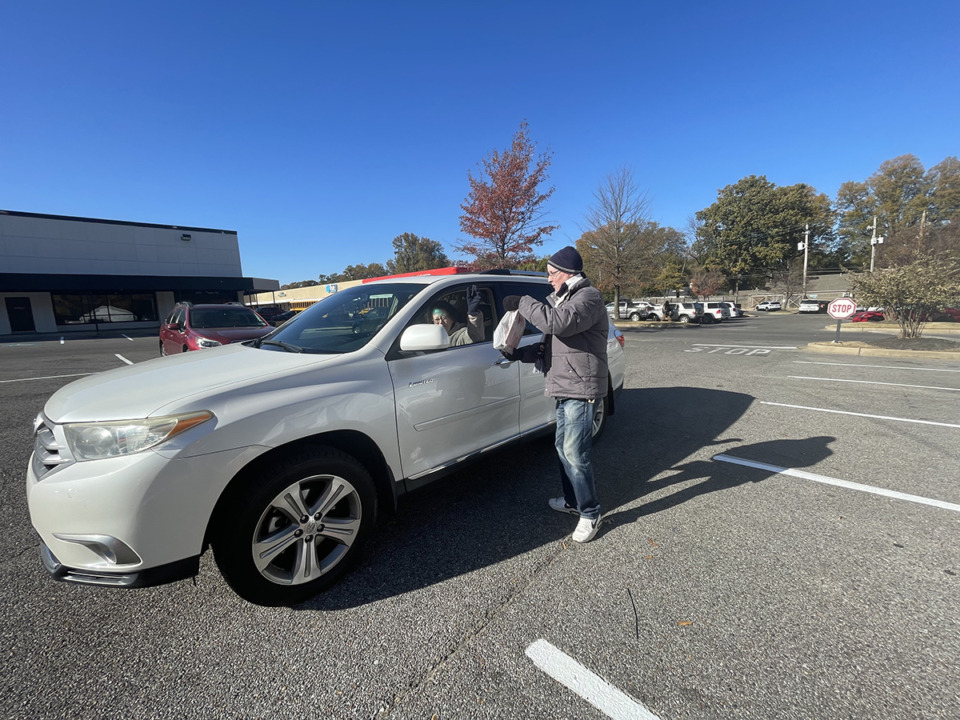 <strong>James O'Toole, development specialist for Porter-Leath, accepts a toy donation Thursday, Dec. 5. Porter-Leath is hosting its annual Toy Truck drive, which will take place throughout the next three weeks.</strong> (Julia Baker/The Daily Memphian)