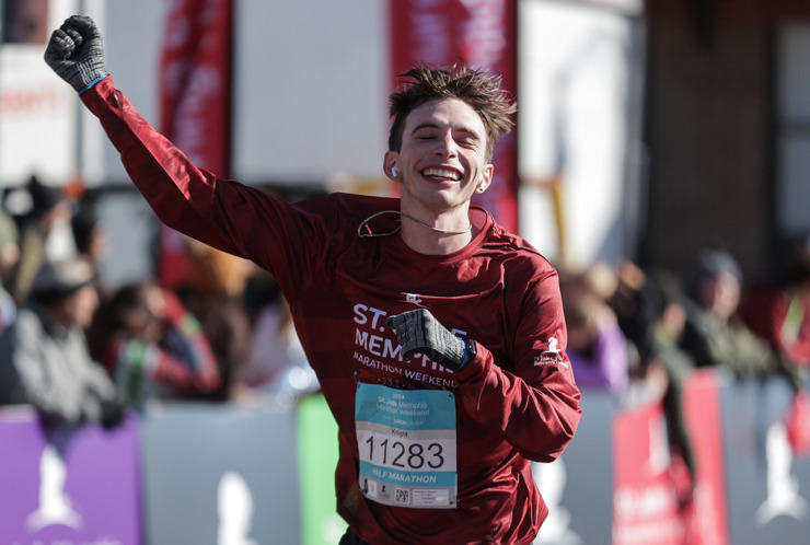 <strong>Nathan Knight celebrates finishing the St. Jude Memphis Marathon on Dec. 7.</strong> (Patrick Lantrip/The Daily Memphian)