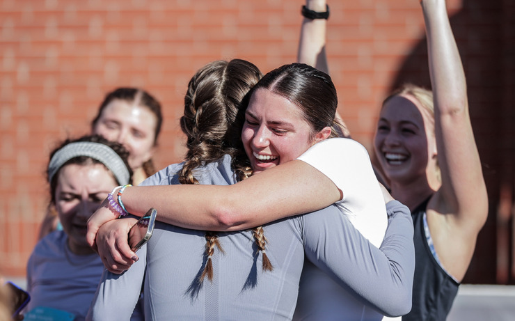 <strong>Annabelle Gallaher hugs her friends after completing the St. Jude Memphis Marathon on Dec. 7.</strong> (Patrick Lantrip/The Daily Memphian)