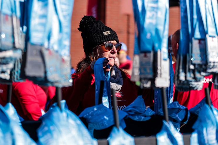 <strong>Amy Evans gets the medals ready for the half-marathon winners during the St. Jude Memphis Marathon on Dec. 7.</strong> (Patrick Lantrip/The Daily Memphian)