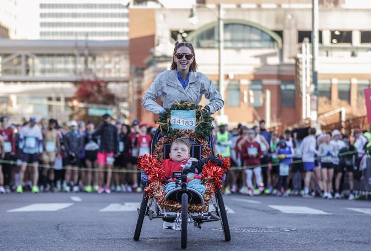 <strong>Alyssa Webb runs with her son Noah, 9, during the St. Jude Marathon on Dec. 7.</strong> (Patrick Lantrip/The Daily Memphian)