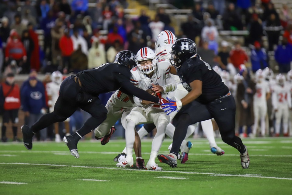 <strong>Houston High's Kedrick Donald (6) and Tony Williams (53) tackle Oakland's Kyler Creasy (6) Saturday, Dec. 7, 2024 in the Blue Cross Bowl at Finley Stadium in Chattanooga, where Houston took on Oakland in a rematch of last year's Class 6A state title football game.</strong> (Olivia Ross/Special to The Daily Memphian)