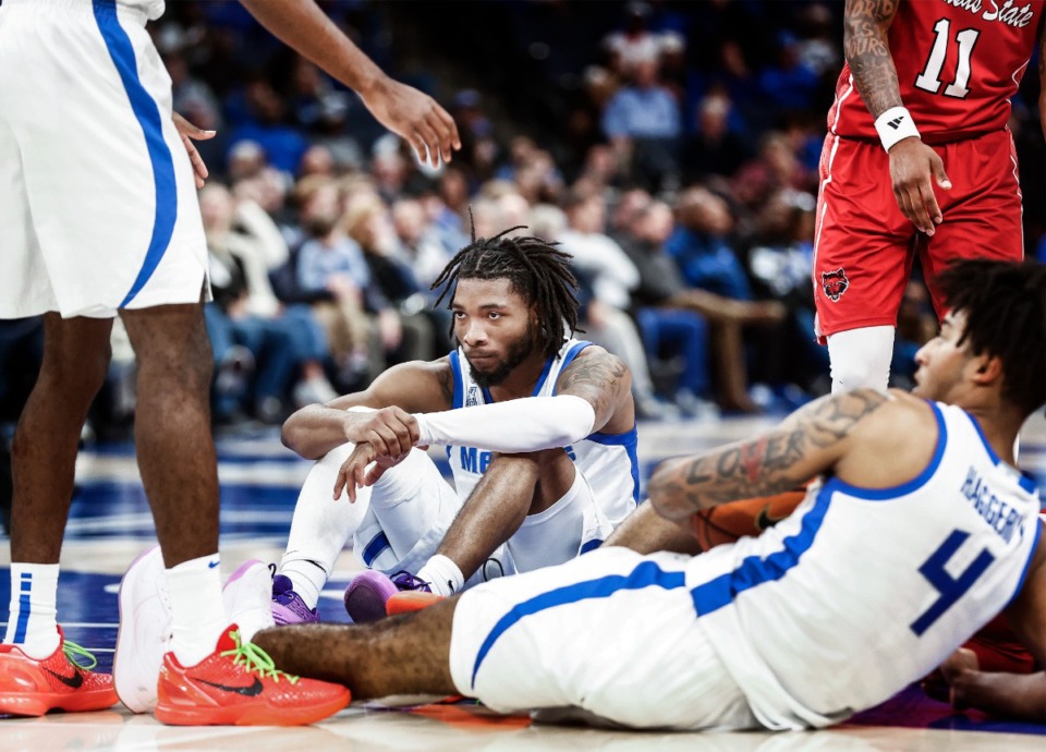 <strong>University of Memphis defender Tyrese Hunter sits on the court after being called for a foul during action against Arkansas State on Sunday, Dec. 8, 2024.</strong> (Mark Weber/The Daily Memphian)