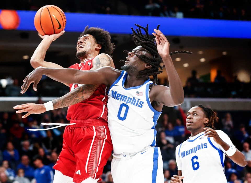 <strong>University of Memphis defender Damarien Yates (right) battles Arkansas State guard Taryn Todd (left) during action on Sunday, Dec. 8, 2024.</strong> (Mark Weber/The Daily Memphian)