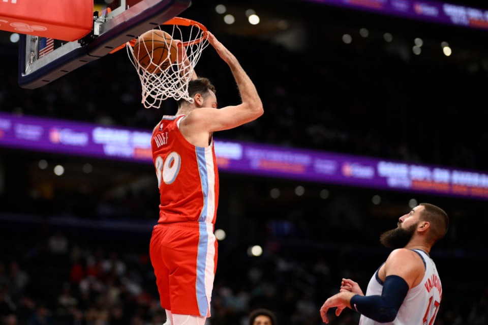 <strong>Memphis Grizzlies center Jay Huff (30) reverse dunks past Washington Wizards center Jonas Valanciunas (17) during the first half of an NBA basketball game, Sunday, Dec. 8, 2024, in Washington.</strong> (AP Photo/Nick Wass)