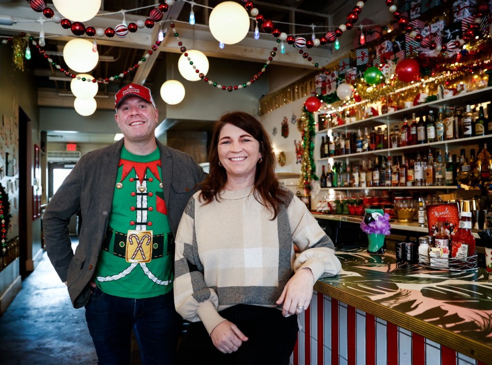 <strong>The Liquor Store&rsquo;s beverage manager Ben Wiley (left) and co-owner Brittney Cabigao (right) curated a holiday-themed menu to match the restaurant&rsquo;s Christmas pop-up.</strong> (Mark Weber/The Daily Memphian)