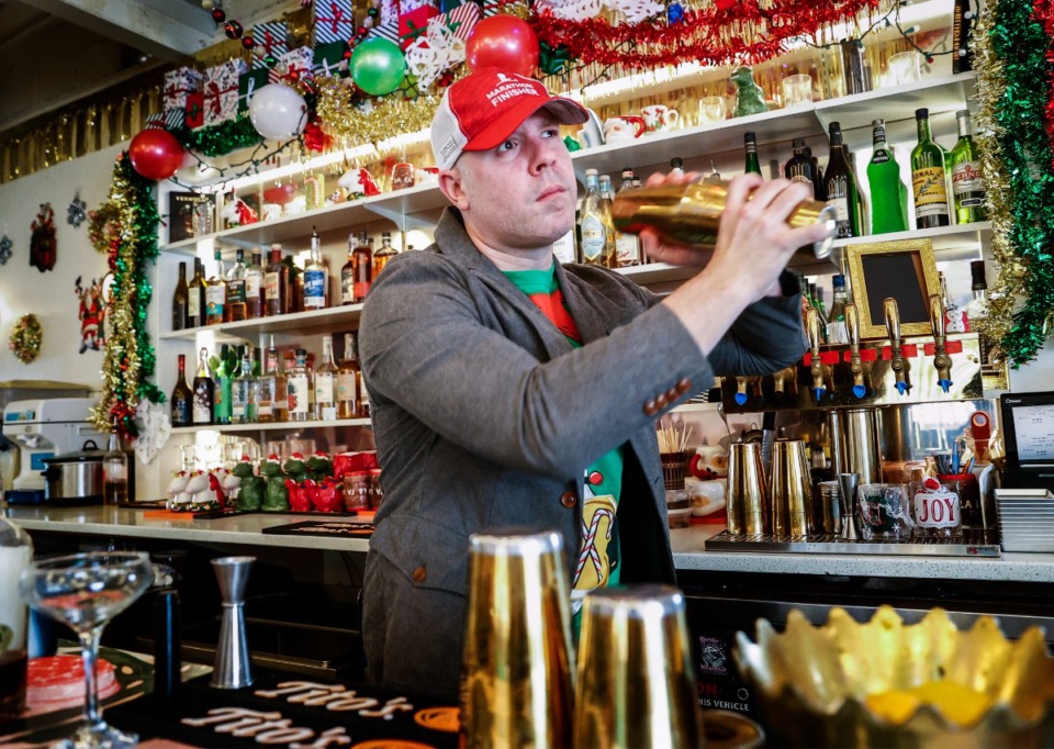 <strong>The Liquor Store&rsquo;s beverage manager Ben Wiley (left) mixes at drink.</strong> (Mark Weber/The Daily Memphian)